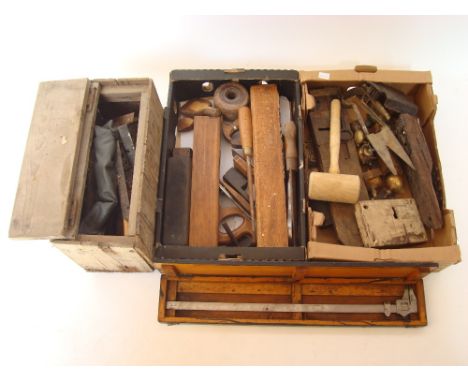 A mixed lot of tools comprising jack planes and other wood working tools, cased Brown & Sharpe steel caliper, antique iron lo