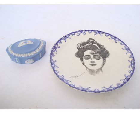 A Royal Doulton 'Gibson Girl' plate, brown transfer decorated with a female portrait, within blue printed ribbon borders, 23.