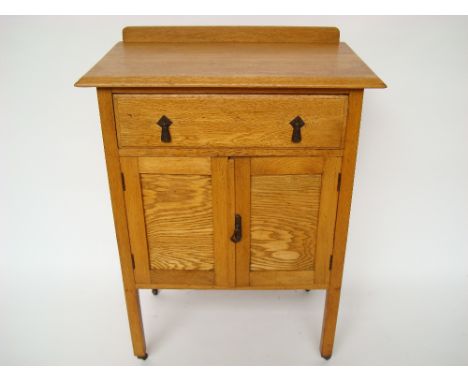 A 1930's light oak cupboard. 