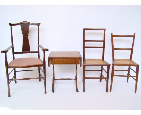 An Edwardian mahogany yoke back open elbow armchair, a pair of side chairs with cane seats and a reproduction regency style m