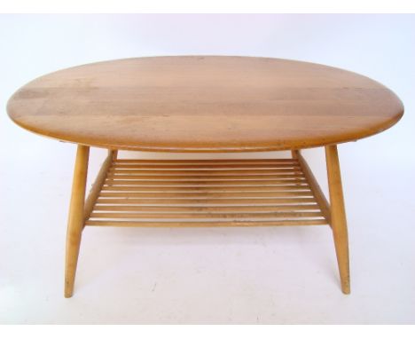 An Ercol style elm oval coffee table. 