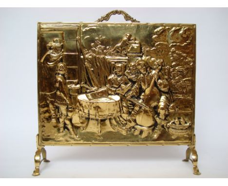An embossed brass firescreen. 