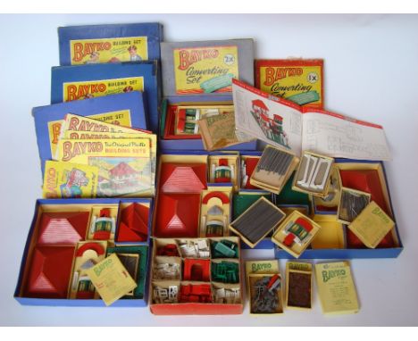 A quantity of Bayko building sets components in original boxes.The three building set boxes each containing roofs, bases, bay