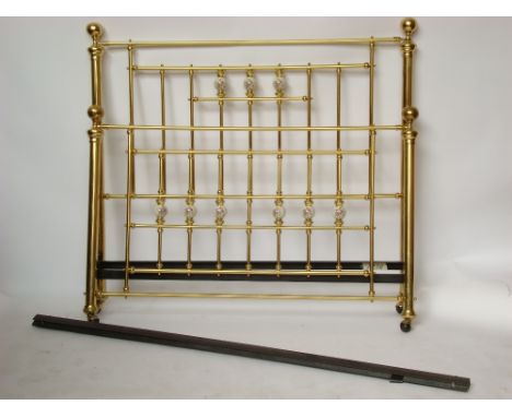 A Victorian style brass ceramic bedstead and irons. 