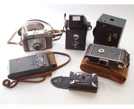 A selection of cameras comprising a Voigtlander SLP folding camera in leather case, Hawkeye box camera, Kodak No 2 Brownie, E
