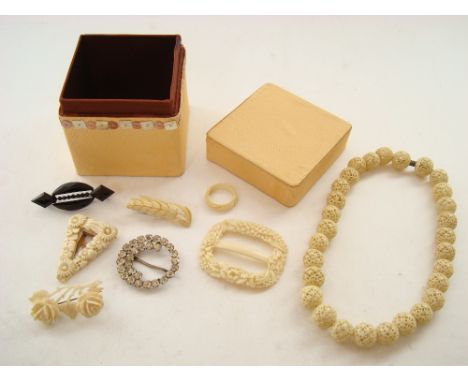 A small quantity of costume jewellery, carved ivory dress clip, ring, brooches etc. 