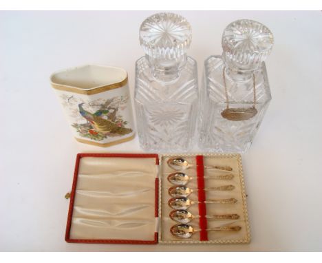A pair of square crystal whisky decanters and stoppers, one with plated bottle ticket, a cased set of six EPNS apostle spoons