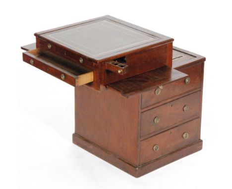 A George IV mahogany Davenport, the tooled leather inset top above a sliding action and side opening inkwell compartment abov