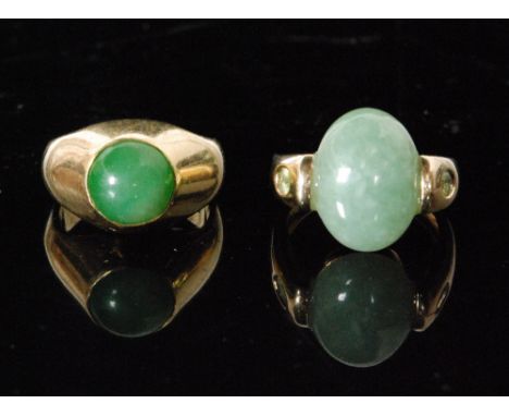 An 18ct jade signet ring the domed setting with circular cabochon, weight 13g, ring size N and another 14ct  jade set dress r