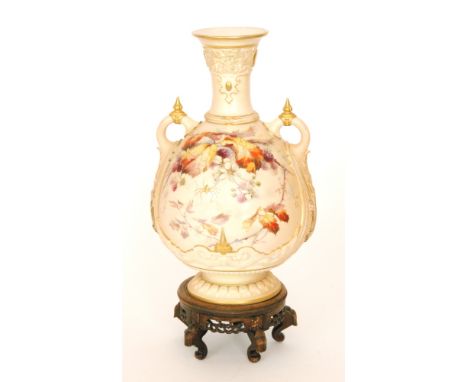 A large late 19th Century Royal Worcester twin handled shape 1553 blush ivory vase decorated with autumnal leaves, berries an