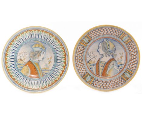 A pair of late 19th Century maiolica plates decorated with a hand painted portrait of a young gentleman in profile to one and