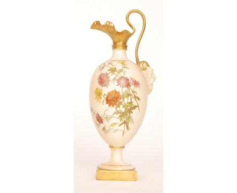 A late 19th Century Royal Worcester shape 1144 pedestal ewer decorated with a spray of gilt and enamel flowers against a blus