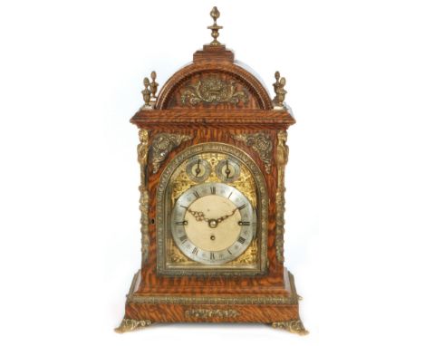 A late 19th Century musical bracket clock with pull cord striking on eight graduated bells with circular silvered chapter rin