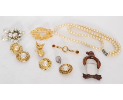 A small parcel lot of costume jewellery to include two pairs of gilt metal Chanel clip earrings, a gilt metal fox brooch, a m