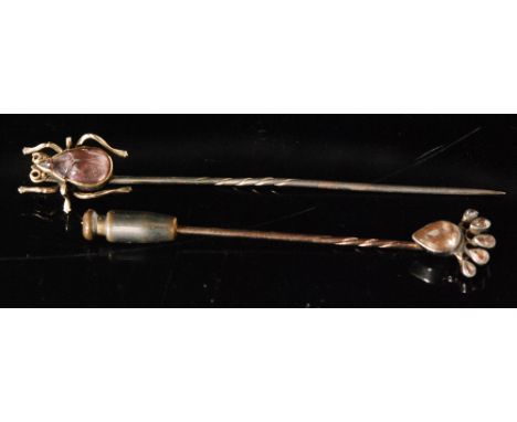 An Edwardian diamond mounted jabot pin, old pear cut diamond with five diamond surmount to a 9ct rose gold pin and another am