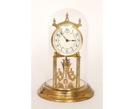 A 20th Century brass 365 day mantle clock in glass dome, height 29cm