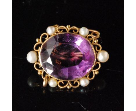 A Victorian 14ct amethyst and seed pearl oval brooch,  mixed cut amethyst collar set within a scrolled border and six  seed p