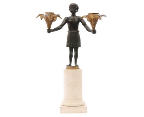 A 19th Century French Empire period candlestick modelled as an African boy in grass skirt with arms outstretched holding alof