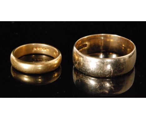 A modern 22ct hallmarked D shaped wedding ring, weight 6.3g, ring size leading edge k 1/2, with a 9ct example. (2) 