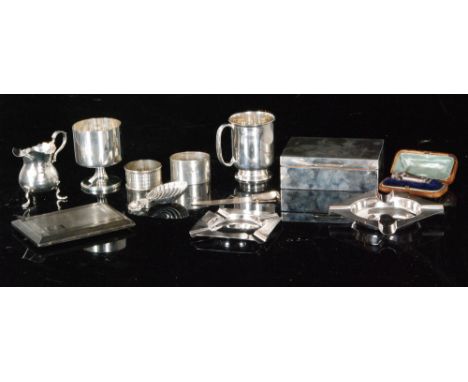 A small parcel lot of hallmarked silver items, a cigarette box and case, two ashtrays, napkin rings, caddy spoon, bookmarks, 