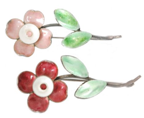 Two silver and enamel brooches, each modelled as a single flower, one with pink petals, the other with red to a scrolled leaf
