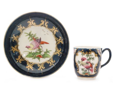 A late 18th Century Worcester coffee cup and saucer decorated with cartouche panels of 'Fancy Birds' and insects against a fa