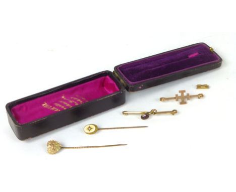 Four assorted gold and yellow metal tie pins 