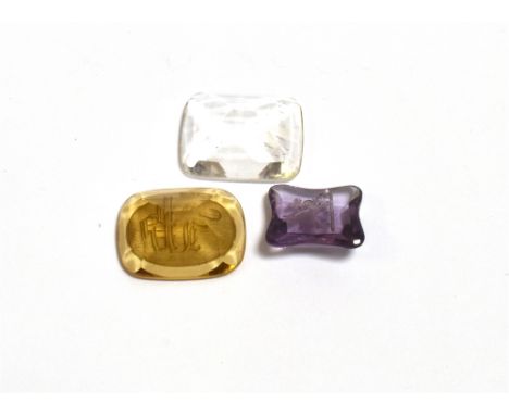 LOOSE GEMSTONE INTAGLIOS To inlcude a 13.3 x 11.6mm amethyst intaglio depicting a finely carved Wyvern, a monogrammed 17.7 x 