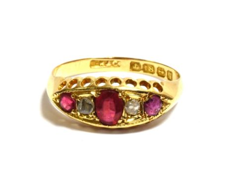 18CT GOLD RUBY, PASTE &amp; DIAMOND RING Navette shaped grain set head with red paste stones and a round cut ruby flanked by 