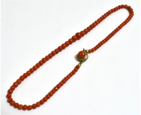 VINTAGE CORAL BEAD NECKLACE 40cm long, comprising graduated 4.0-7.7mm round natural coral beads, secured with a silver gilt c