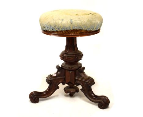 Victorian rosewood revolving music stool, having carved tripod base  