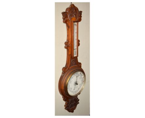 Early 20th Century carved oak-cased aneroid barometer with thermometer, Winter &amp; Son, Newcastle, 85cm high  