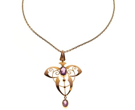 Early 20th Century Art Nouveau yellow metal and amethyst pendant of whiplash design set two purple stones, stamped 9ct, toget