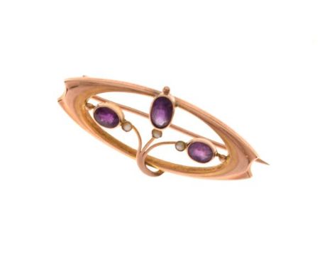 Murrle Bennett - Arts &amp; Crafts yellow metal and amethyst bar brooch of oval design set three stones and seed pearls, stam