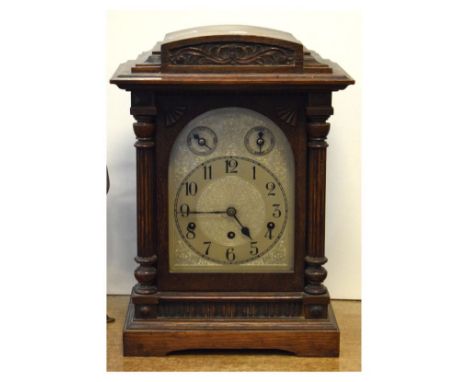 Early 20th Century German oak-cased chiming bracket clock, Kienzle, with silvered arch Arabic dial and subsidiary Slow/fast a