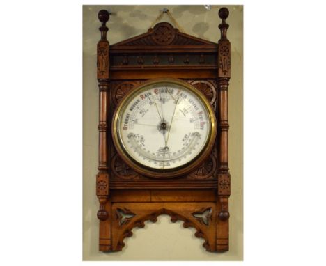 Late Victorian Aesthetic period carved oak aneroid barometer, with architectural case, 58cm high  
