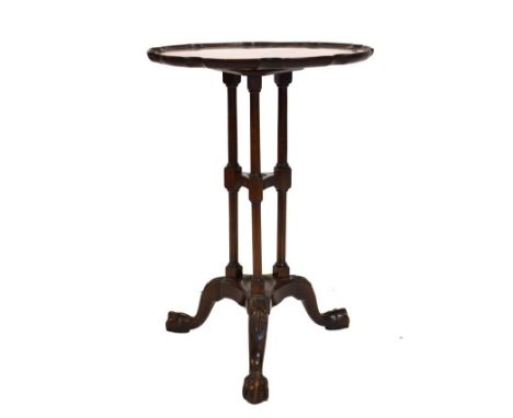 Reproduction mahogany occasional table having pie-crust edge, triple column supports and tripod base, 45.5cm wide  