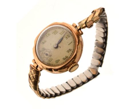 Early 20th Century lady's 9ct gold wristwatch, cream Arabic dial, manual wind movement, flexible bracelet  