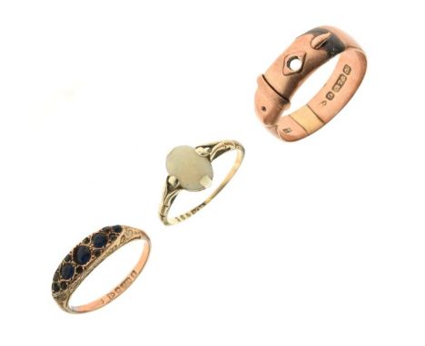 Two 9ct gold dress rings, one set with oval opal cabochon, the other designed as a belt, together with a yellow metal and blu