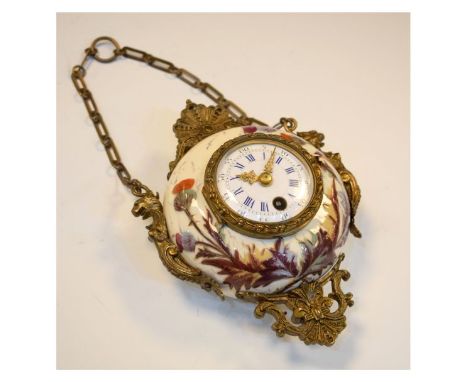 Late 19th Century Continental gilt metal-mounted ceramic timepiece, the 2.25-inch white-enamel convex dial with blue Roman ho