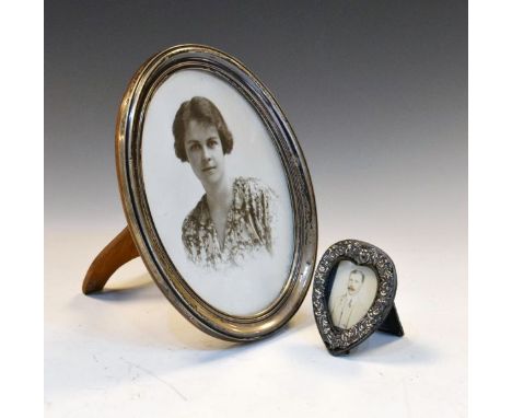 Edward VII heart shaped picture frame, the silver frame with embossed decoration, Birmingham 1907, together with a George V s