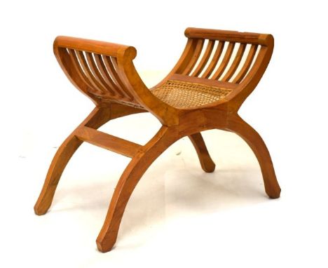 Walnut X framed stool having cane seat  