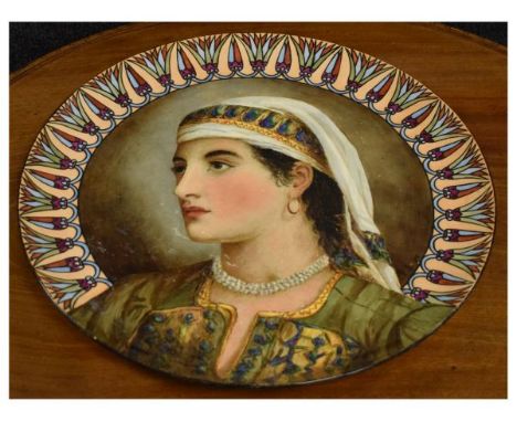 Late 19th Century Continental pottery charger with over glaze enamel portrait of a lady in Egyptian costume, signed E.G (18)'