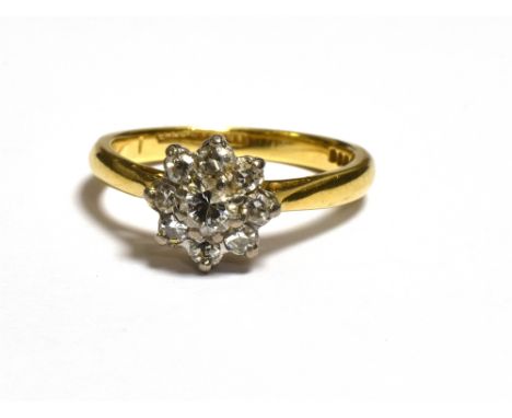 18CT GOLD &amp; DIAMOND FLORAL CLUSTER RING set with one round brilliant cut and eight single cut diamonds, estimated to tota