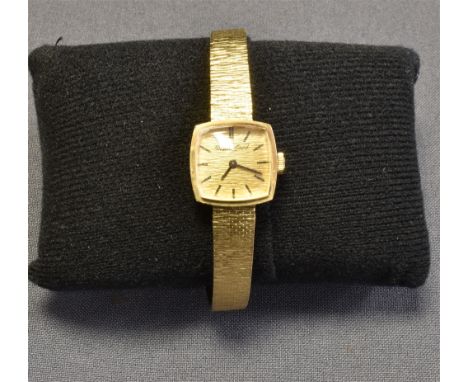 LADIES 9CT GOLD BUECHE-GIROD WATCH 17.5mm cushion shaped case, gold bark textured dial, black batons and hands, 8.4-6.8mm Mil
