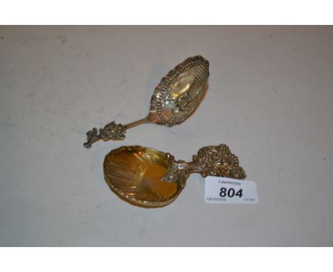 Tiffany and Co. silver gilt caddy spoon, together with a similar Continental silver spoon