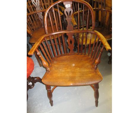 Similar Windsor armchair with pierced splat and stick back above turned supports with crinoline stretcher