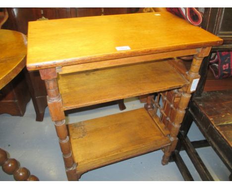 Leonard Wyburd for Liberty, an oak three shelf bookstand on turned supports with slatted ends