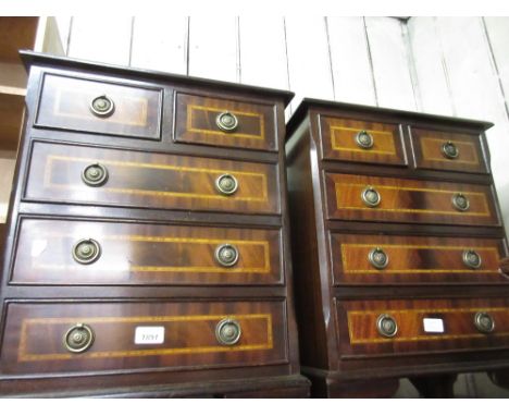 Pair of 20th Century mahogany line inlaid and crossbanded bedside chests of two short over three long drawers with brass ring