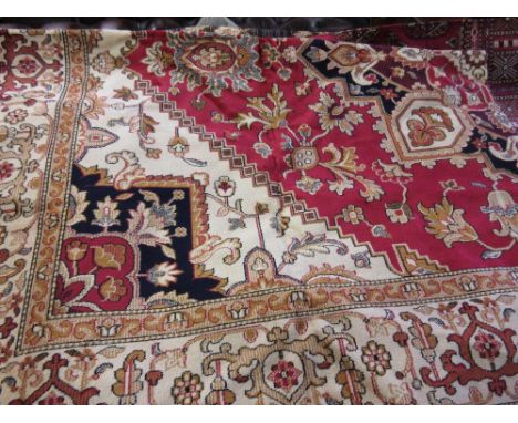 Machine made Heriz pattern carpet on red ground, 2.3m x 1.6m